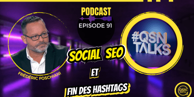 Visuel promotionnel de l’épisode 91 du podcast « QSN Talks », dédié aux réseaux sociaux et à l’eRéputation, animé par Frédéric Foschiani. L’épisode traite du Social SEO et de la fin de l’usage des hashtags. Le visuel montre à gauche un portrait de Frédéric Foschiani, au centre le titre de l’épisode et à droite un logo 3D « #QSN Talks » dans un cercle jaune. L’arrière-plan est un couloir violet lumineux, et le bas de l’image affiche le logo QSN-DigiTal. Design moderne et impact visuel fort pour attirer les professionnels du digital, du marketing et du référencement naturel.